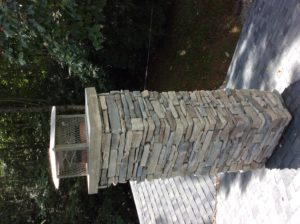 stone chimney with stainless steel cap