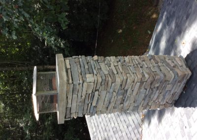 stone chimney with stainless steel cap