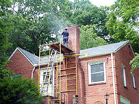man doing repair work with scaffolding