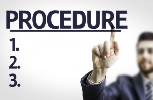 man pointing to procedure graphic