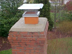 masonry chimney with stainless steel cap
