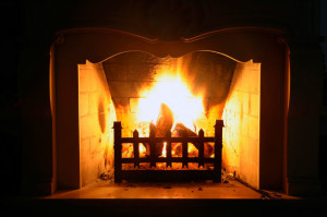 wood fireplace with blazing fire