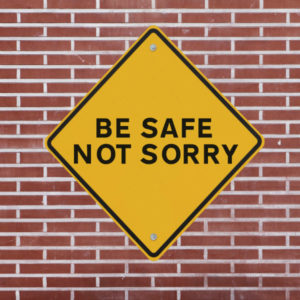 safety sign against brick wall