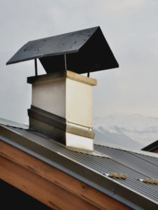 chimney cap on metal roof